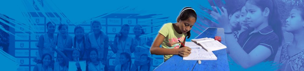 A student writing at her desk during class